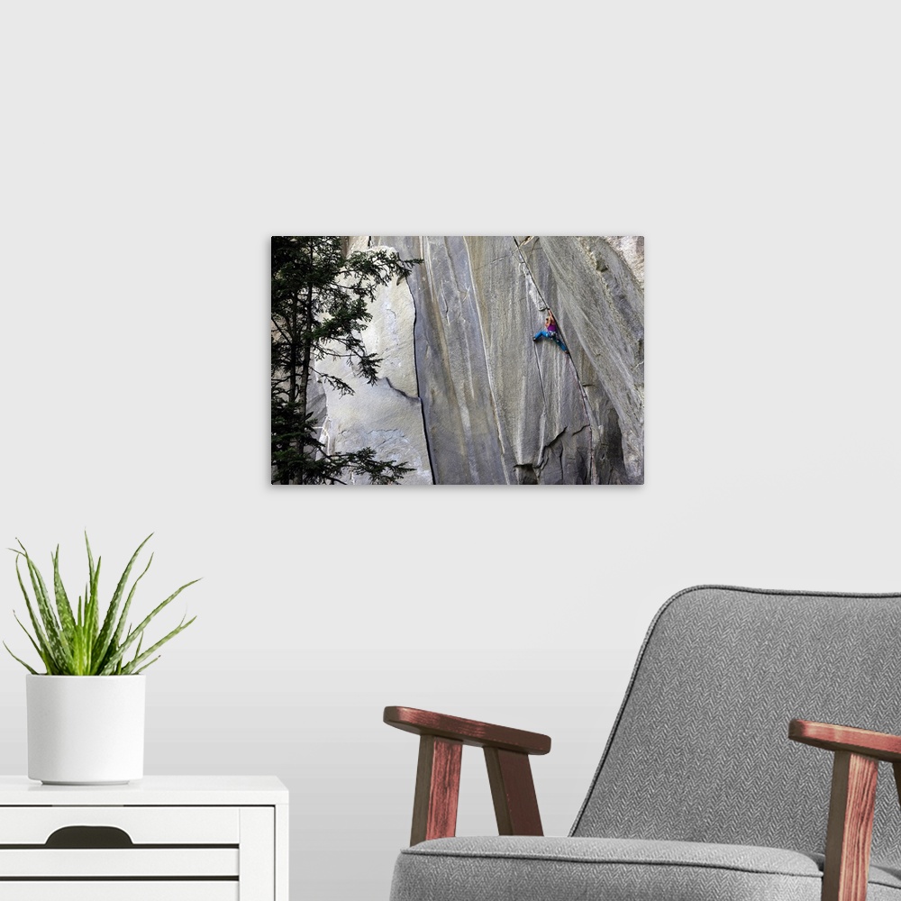 A modern room featuring A climber ascending a difficult crack climb, Cadarese Valley, northern Italy, Europe