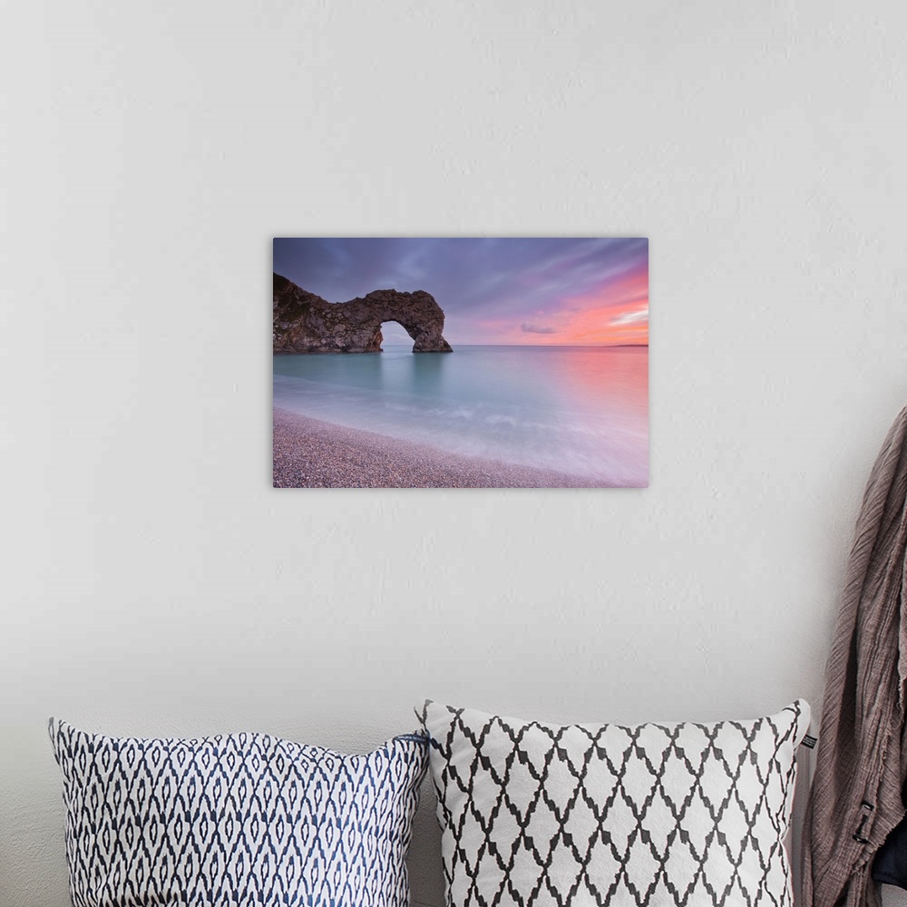 A bohemian room featuring A colourful sunset over Durdle Door on the Jurassic Coast, UNESCO World Heritage Site, Dorset, En...