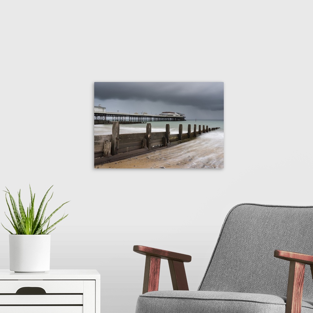 A modern room featuring A stormy sky over the beach and pier at Cromer, Norfolk, England