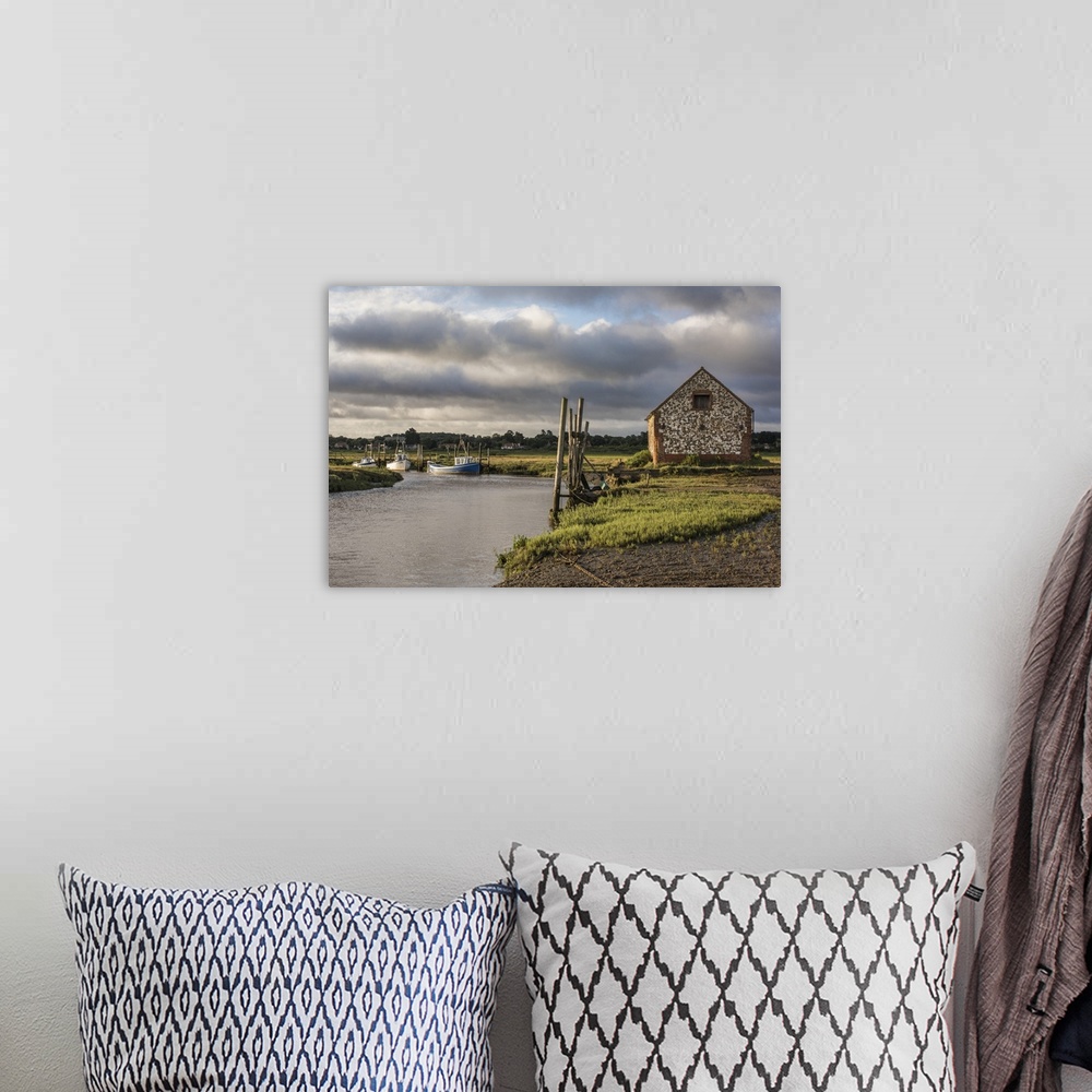 A bohemian room featuring A view of boats moored in the creek at Thornham, Norfolk, England