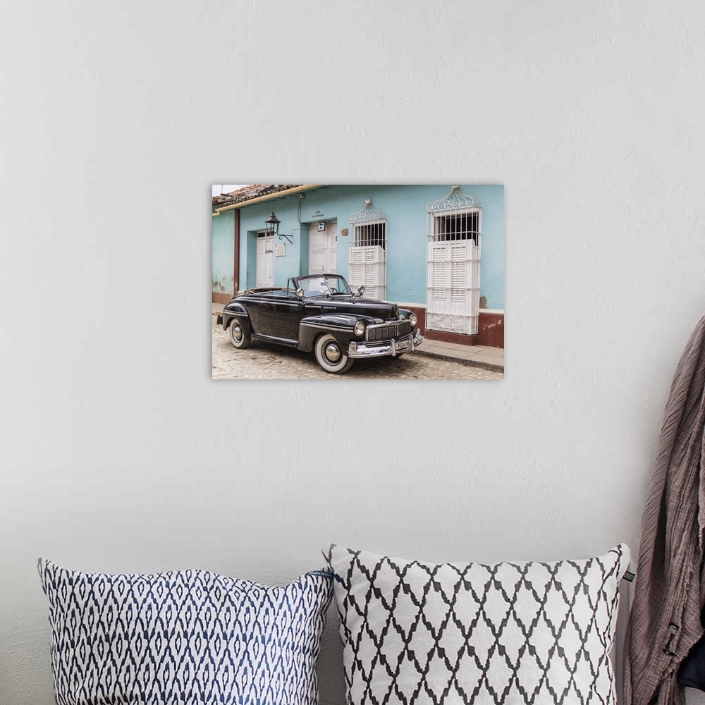 A bohemian room featuring A vintage 1948 American Mercury Eight working as a taxi in the town of Trinidad, Cuba, West Indie...