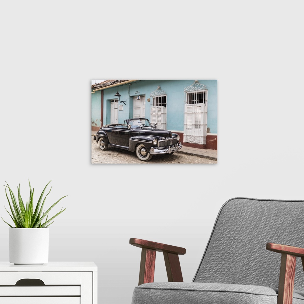 A modern room featuring A vintage 1948 American Mercury Eight working as a taxi in the town of Trinidad, Cuba, West Indie...
