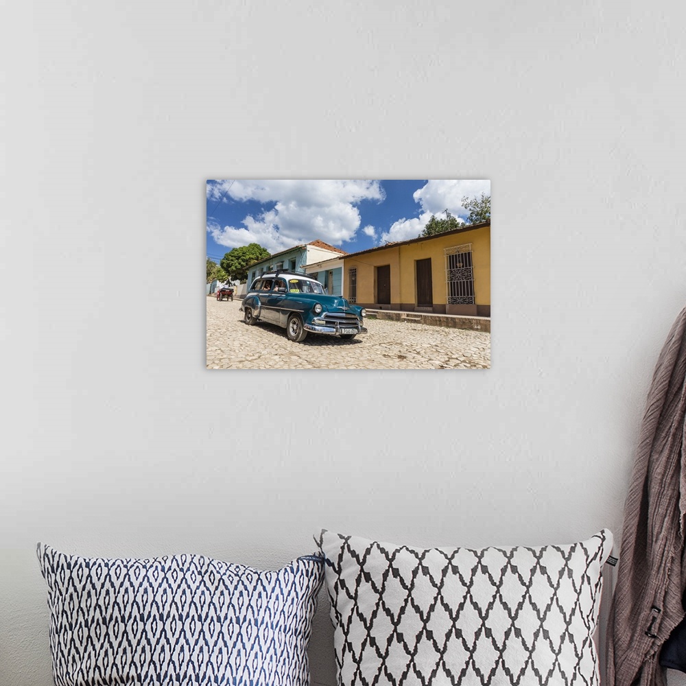 A bohemian room featuring A vintage 1950's American car working as a taxi in the town of Trinidad, Cuba, West Indies, Carib...
