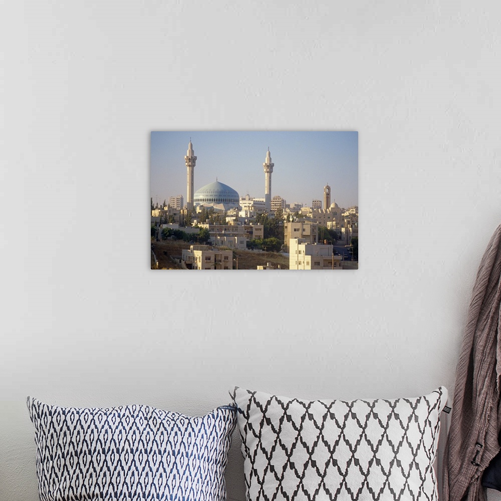 A bohemian room featuring Abdullah Mosque and the Amman skyline at dusk, Jordan, Middle East
