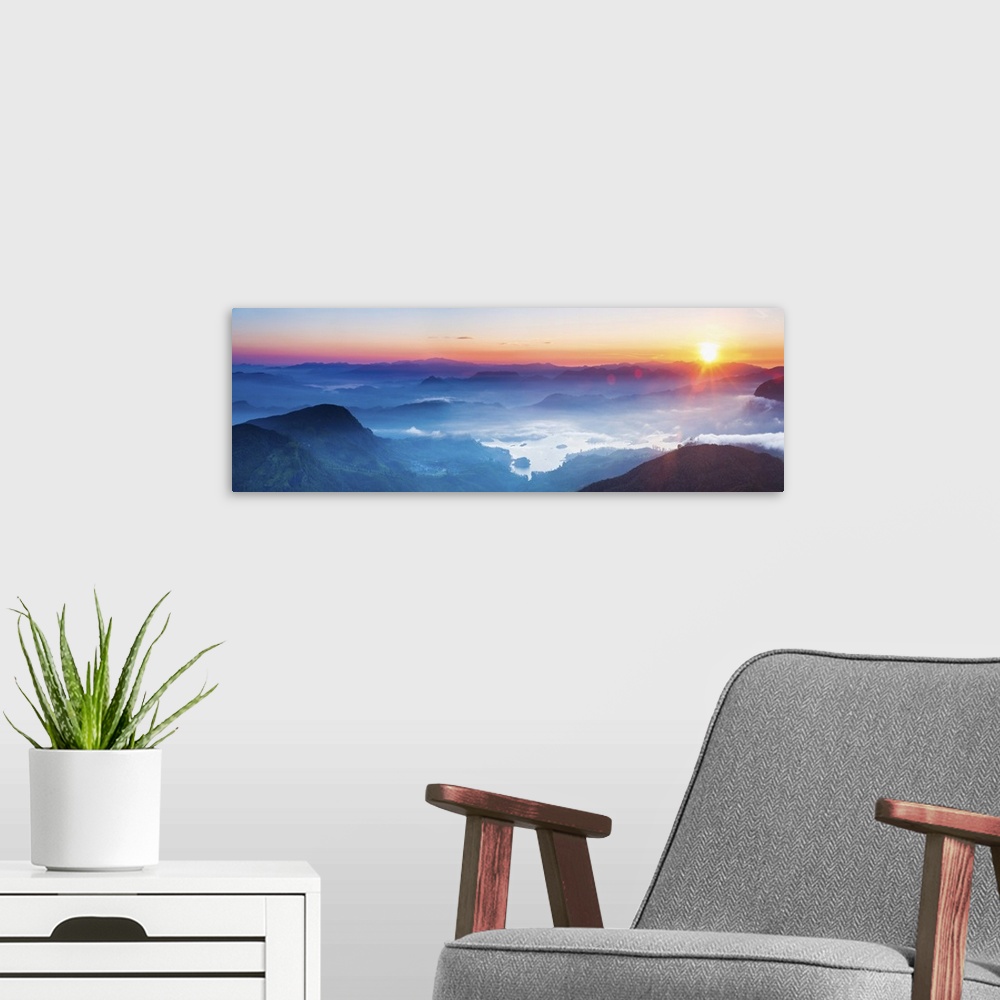 A modern room featuring Adams Peak (Sri Pada) view at sunrise, mountains and the Maussakele Reservoir, Central Highlands,...