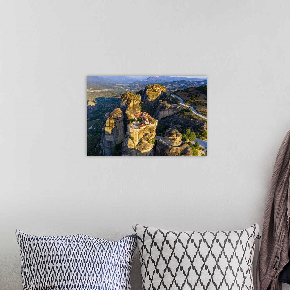 A bohemian room featuring Aerial by drone of the Holy Monastery of Varlaam at sunrise, UNESCO World Heritage Site, Meteora ...