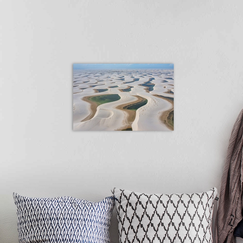 A bohemian room featuring Aerial of freshwater lakes between huge sand dunes in the Lencois Maranhenses National Park, Mara...