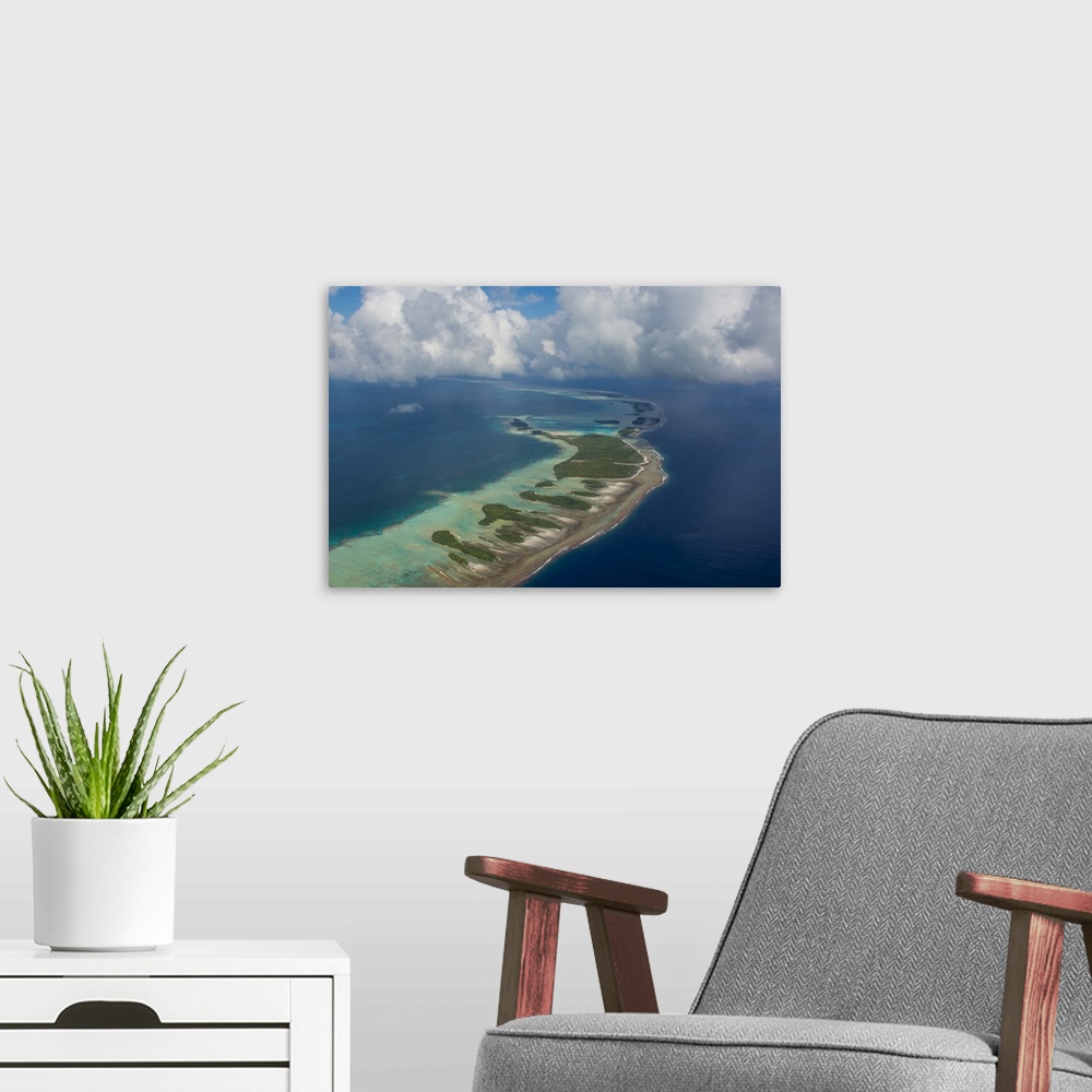 A modern room featuring Aerial of the blue lagoon in Rangiroa, Tuamotus, French Polynesia