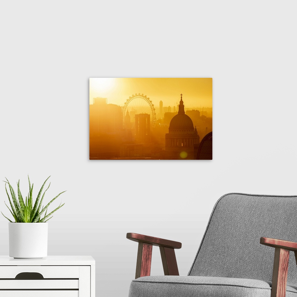 A modern room featuring Aerial view of London skyline at sunset, including London Eye and St. Paul's Cathedral, London, E...