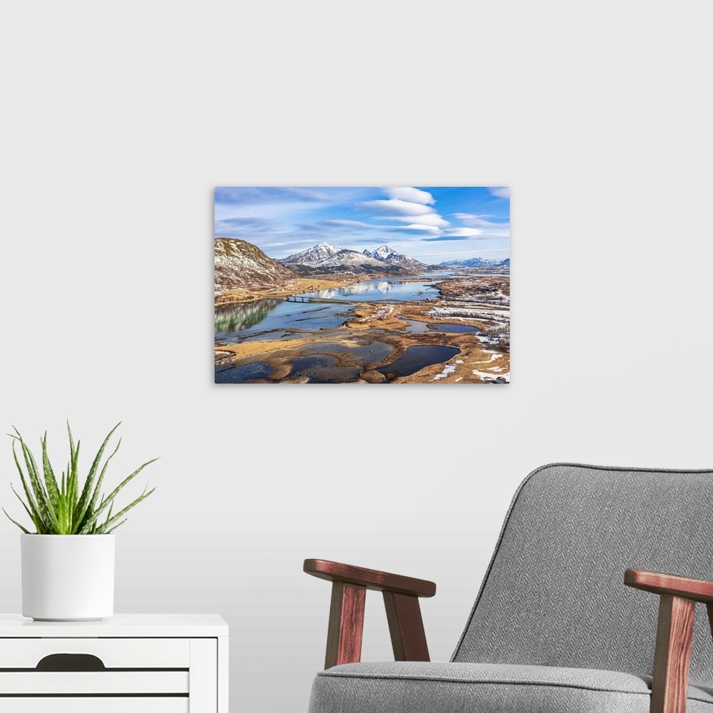 A modern room featuring Aerial view of mountains reflected in the sea, Leknes, Nordland county, Lofoten Islands, Norway, ...