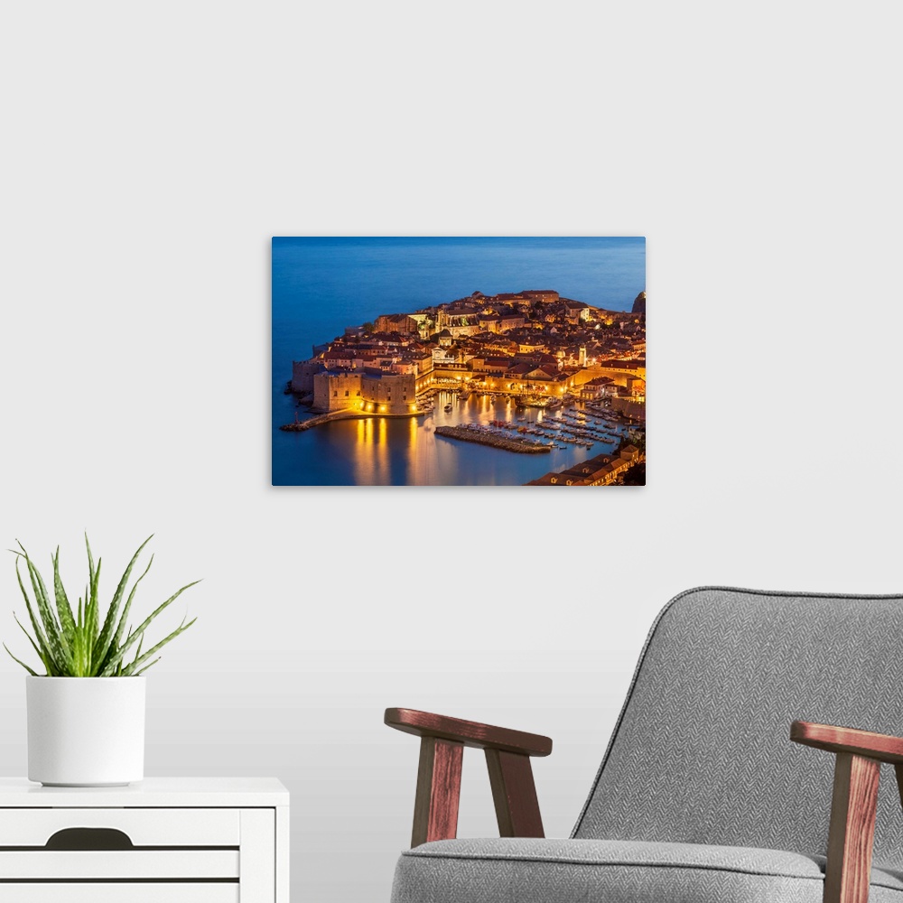 A modern room featuring Aerial view of Old Port and Dubrovnik Old Town at night, Dubrovnik, Dalmatian Coast, Croatia