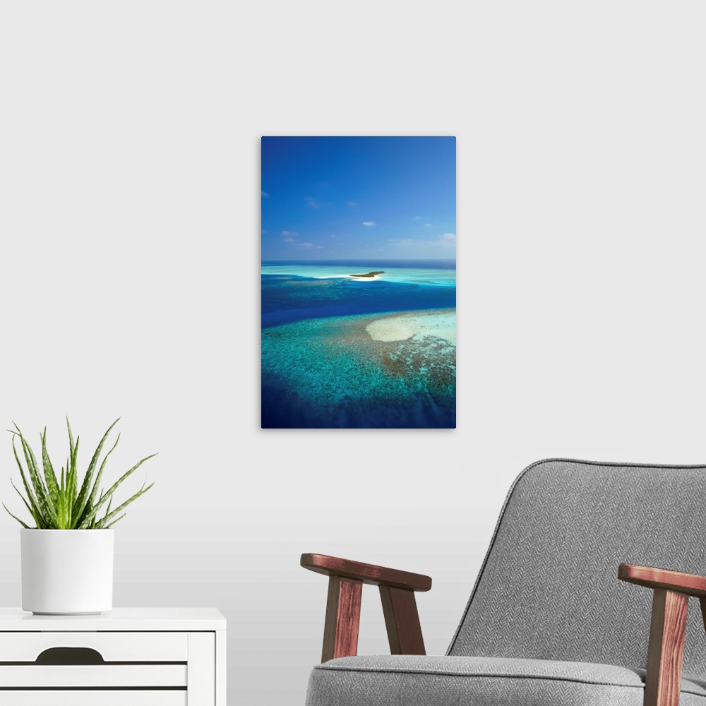 A modern room featuring Aerial view of tropical island and lagoon, Maldives, Indian Ocean, Asia