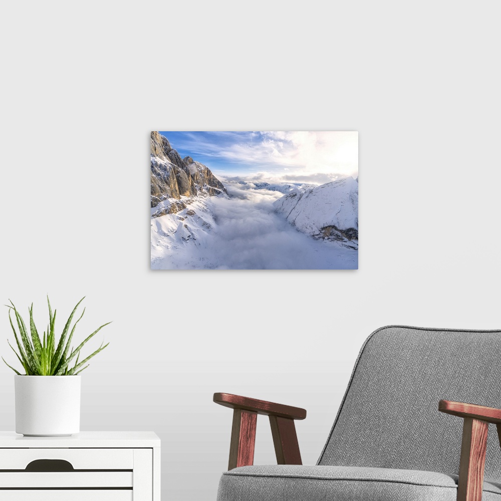 A modern room featuring Aerial view of Valle Ombretta covered by clouds from Marmolada, Dolomites, Veneto, Italy, Europe
