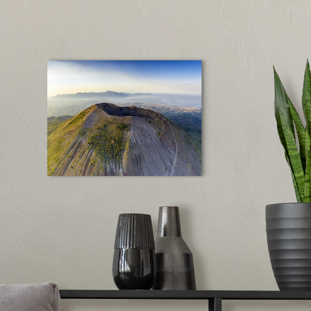A modern room featuring Aerial view of Vesuvius crater and Gulf of Naples at sunrise, Naples, Campania, Italy, Europe