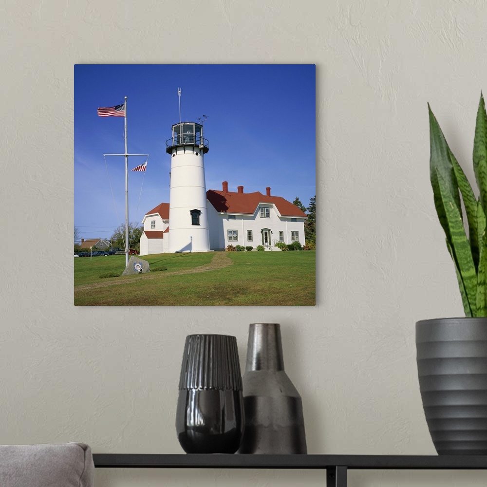 A modern room featuring American flag flying beside the Chatham lighthouse, Cape Cod, Massachusetts