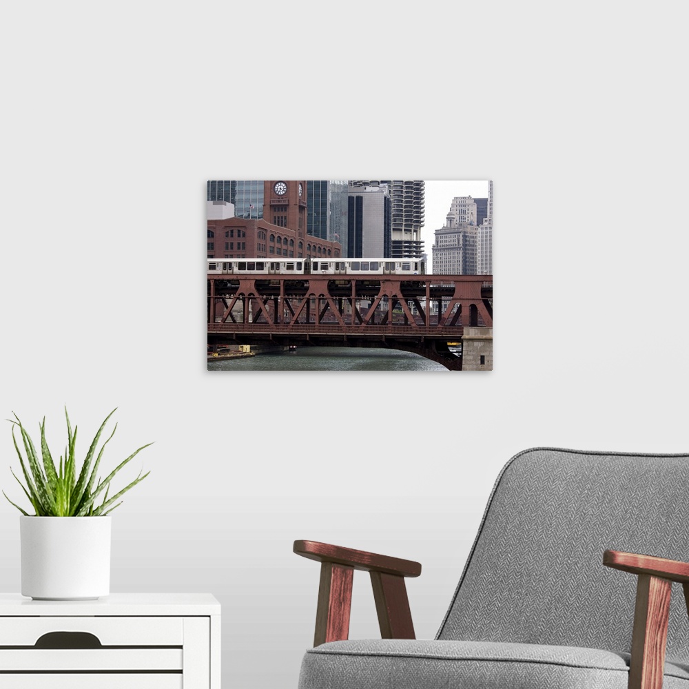 A modern room featuring An El train on the elevated train system crossing Wells Street Bridge, Chicago, Illinois, United ...