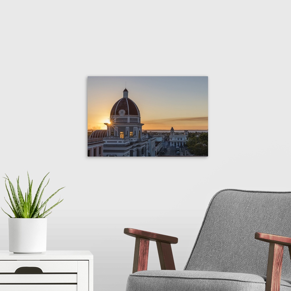A modern room featuring Antiguo Ayuntamiento, home of the provincial government building at sunset, Cienfuegos, Cuba, Wes...