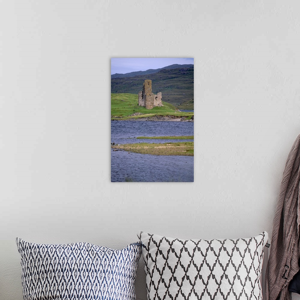 A bohemian room featuring Ardwreck Castle, on the shores of Loch Assynt, Highland region, Scotland, UK