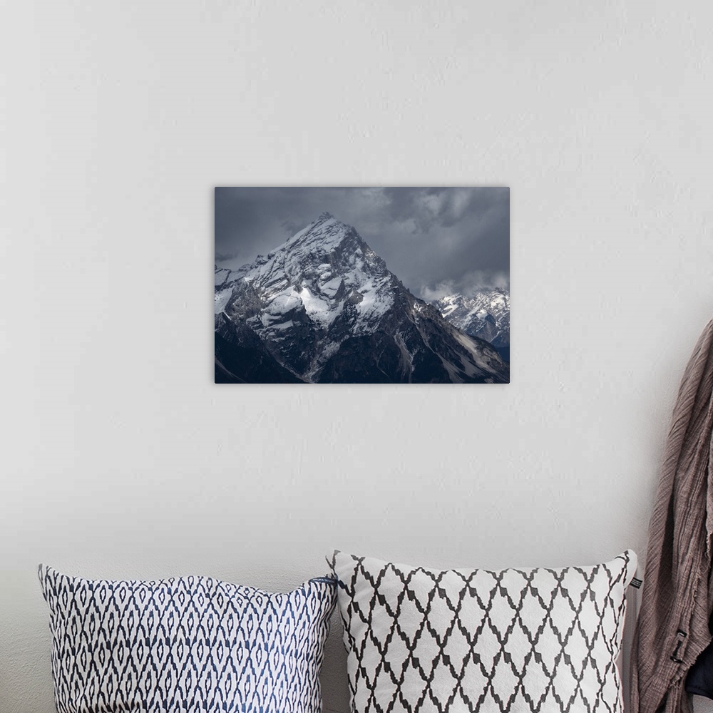 A bohemian room featuring Averau mountain covered by snow and with light rays filtering through clouds, Dolomites, Belluno,...