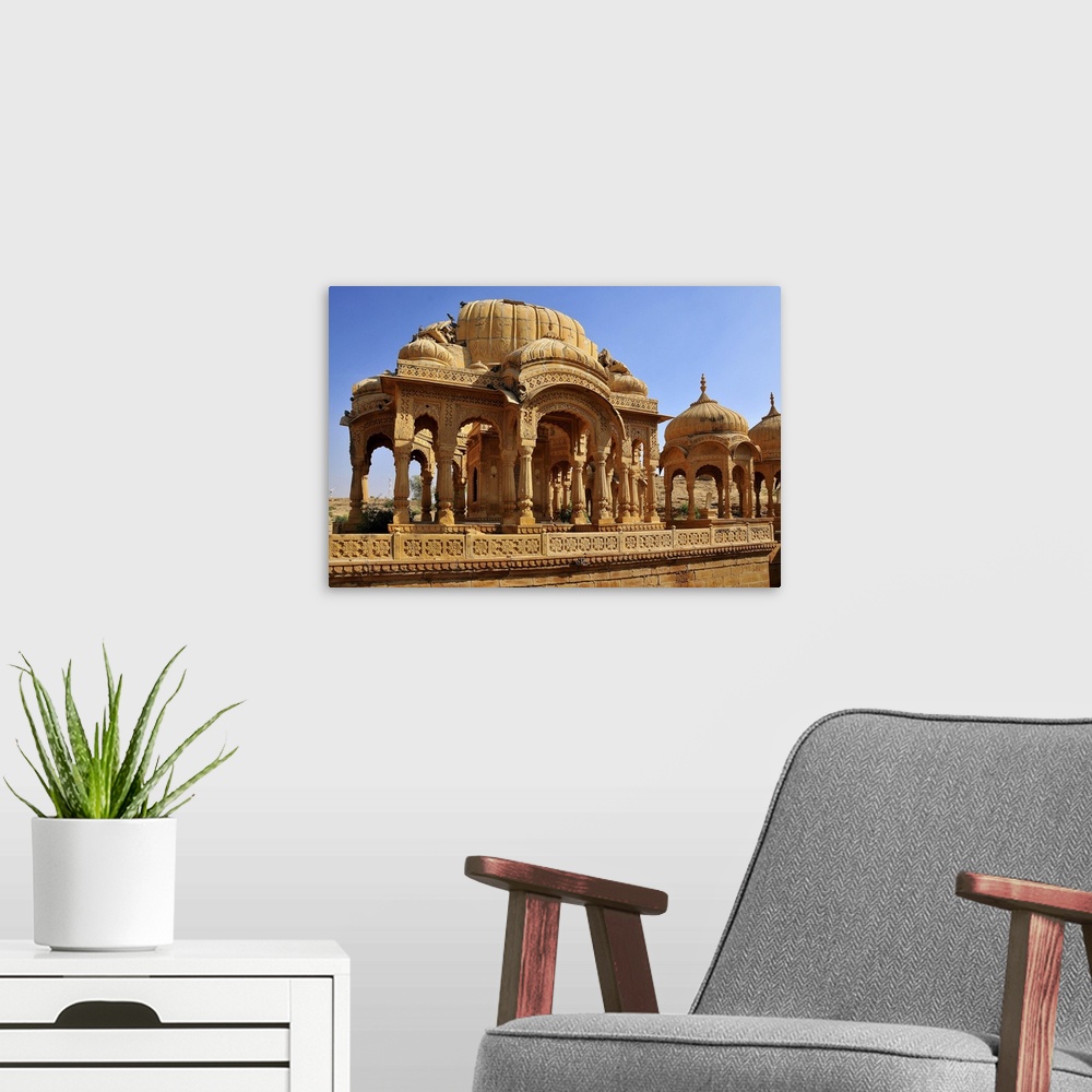 A modern room featuring Bada Bagh (Barabagh), royal cenotaphs (chhatris) of Maharajas of Jaisalmer State, Jaisalmer, Raja...