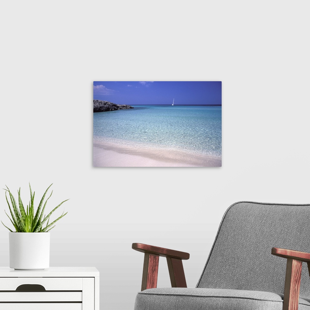 A modern room featuring Beach and sailing boat, Formentera, Balearic Islands, Spain, Mediterranean