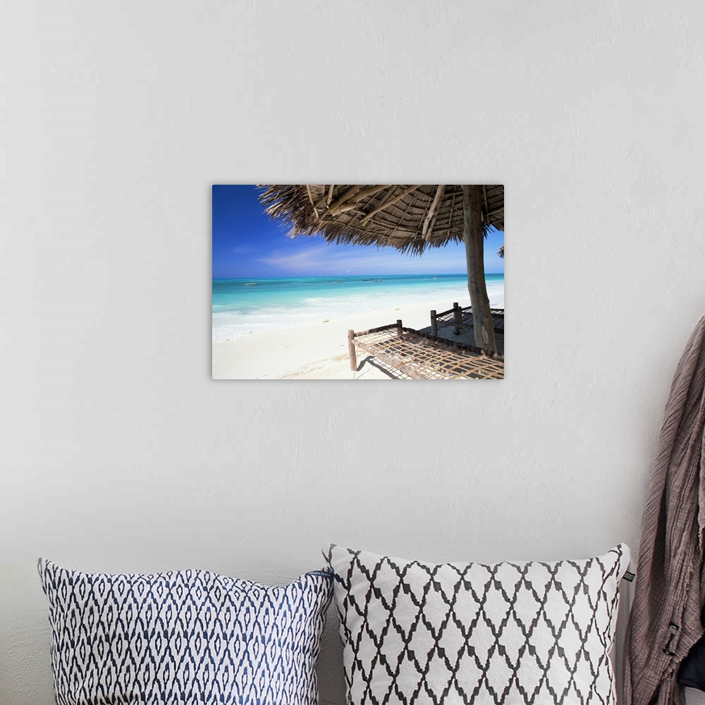 A bohemian room featuring Beach parasol overlooking Indian Ocean, island of Zanzibar, Tanzania, Africa