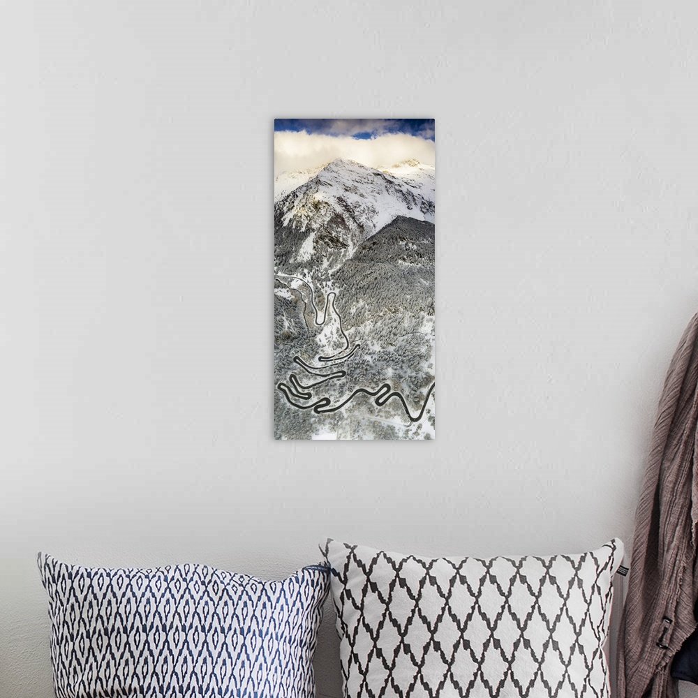 A bohemian room featuring Bends of Maloja Pass road on snowy mountain ridge, aerial view, Bregaglia Valley, Engadine, canto...
