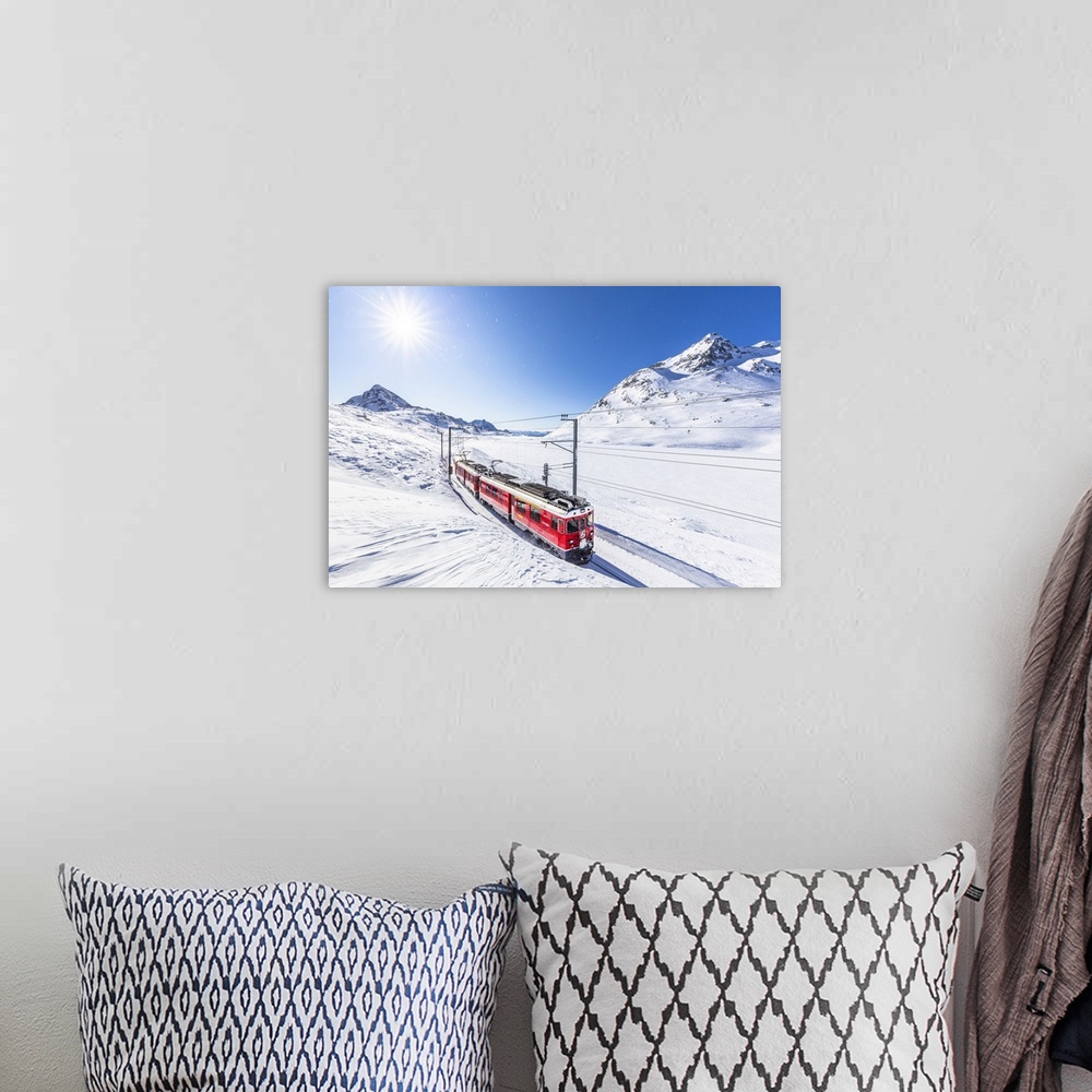 A bohemian room featuring Bernina Express transit along Lago Bianco in winter, Bernina Pass, Engadine, Canton of Graubunden...