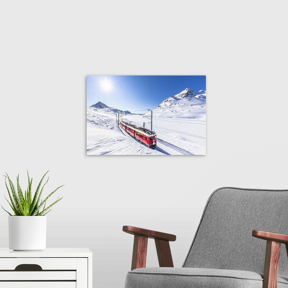 A modern room featuring Bernina Express transit along Lago Bianco in winter, Bernina Pass, Engadine, Canton of Graubunden...