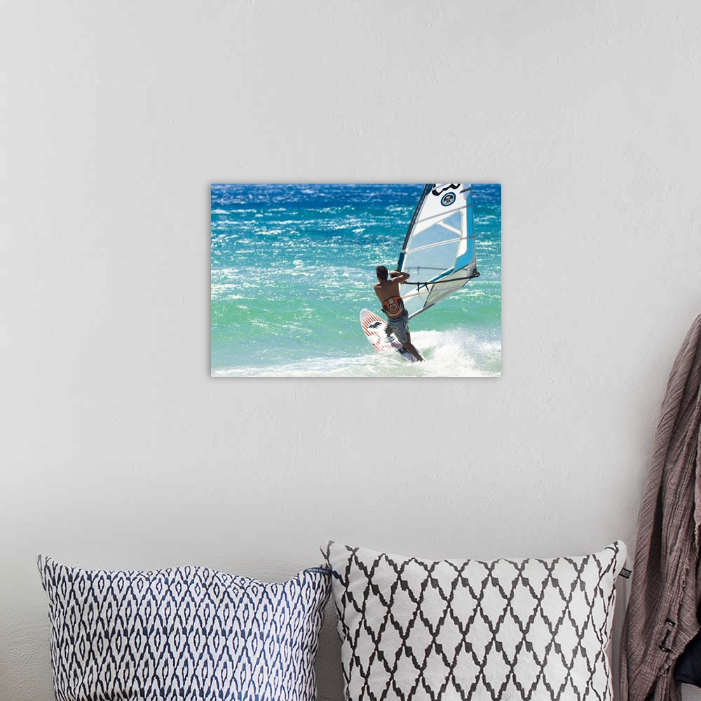 A bohemian room featuring Big Jump windsurfing in high Levante winds in the Strait of Gibraltar, Andalucia, Spain