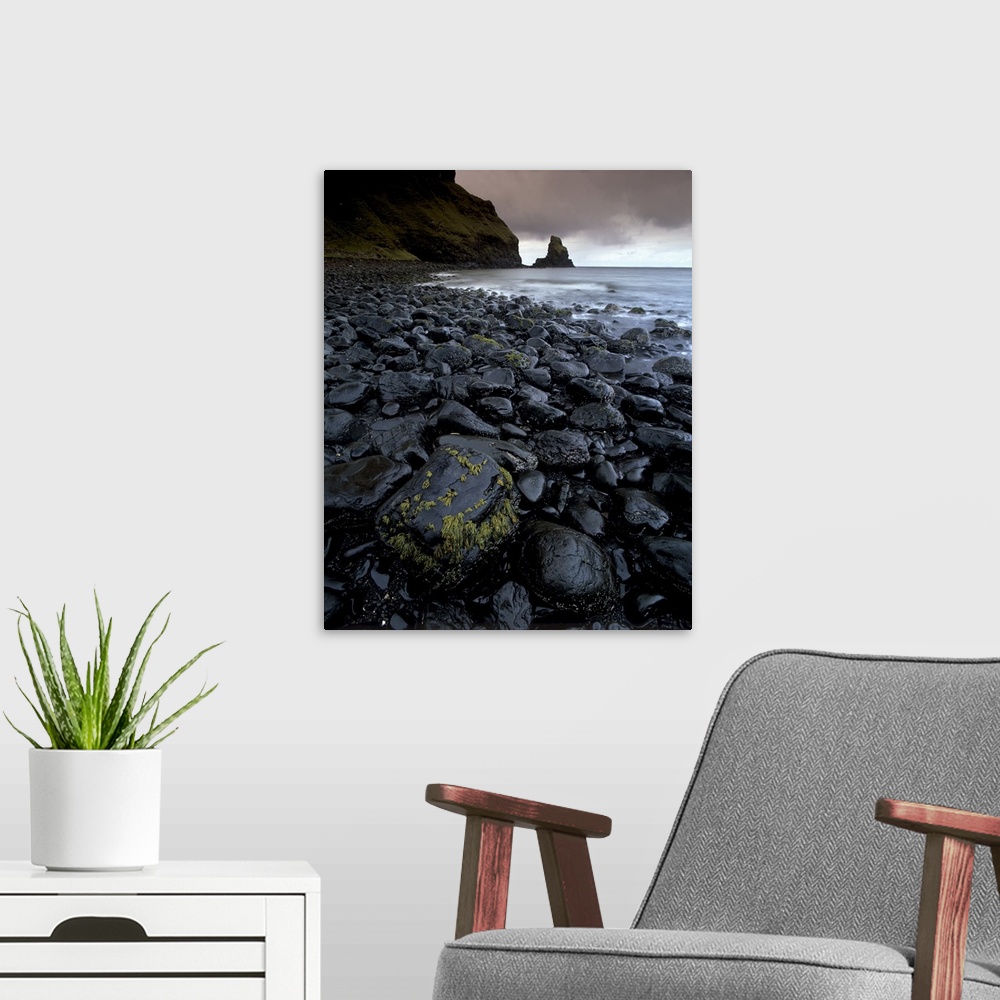 A modern room featuring Black boulder rocks in Talisker Bay, Isle of Skye, Inner Hebrides, Scotland, UK
