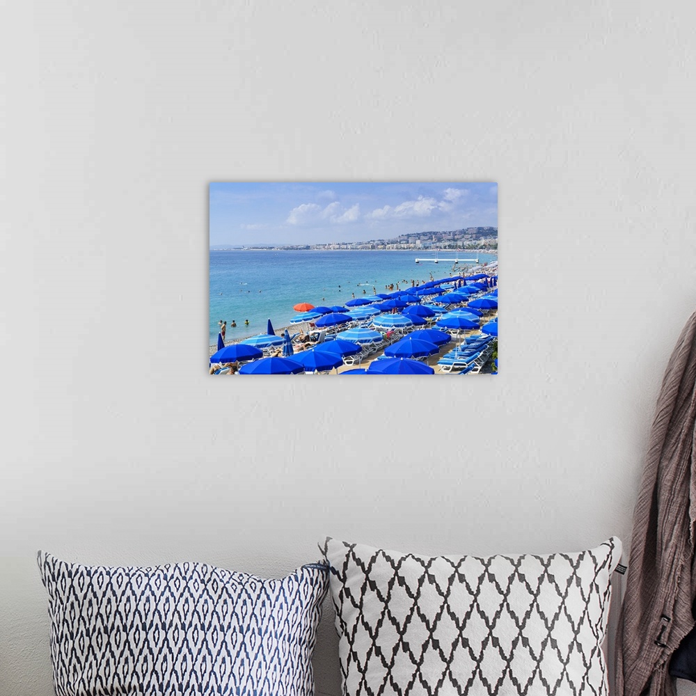A bohemian room featuring Blue parasols on the beach, Promenade des Anglais, Nice, Alpes Maritimes, Cote d'Azur, Provence, ...