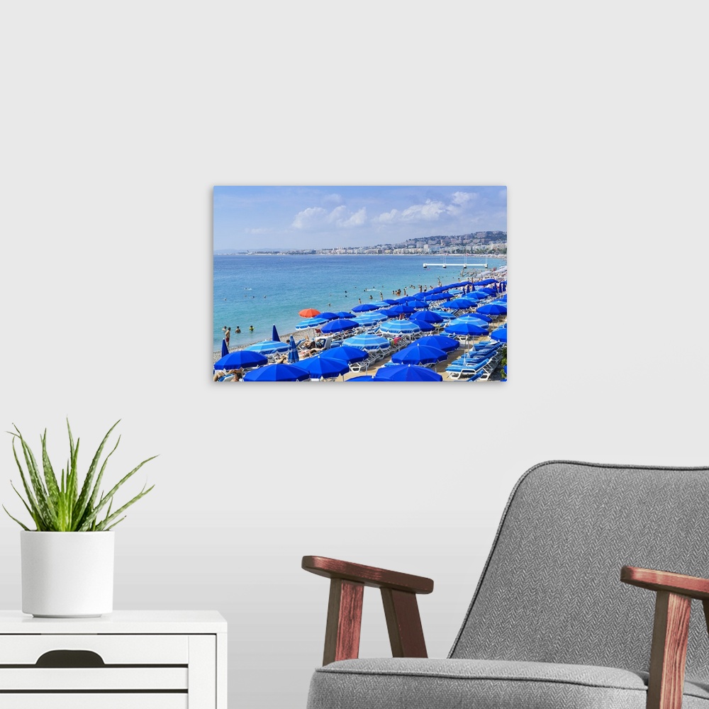 A modern room featuring Blue parasols on the beach, Promenade des Anglais, Nice, Alpes Maritimes, Cote d'Azur, Provence, ...