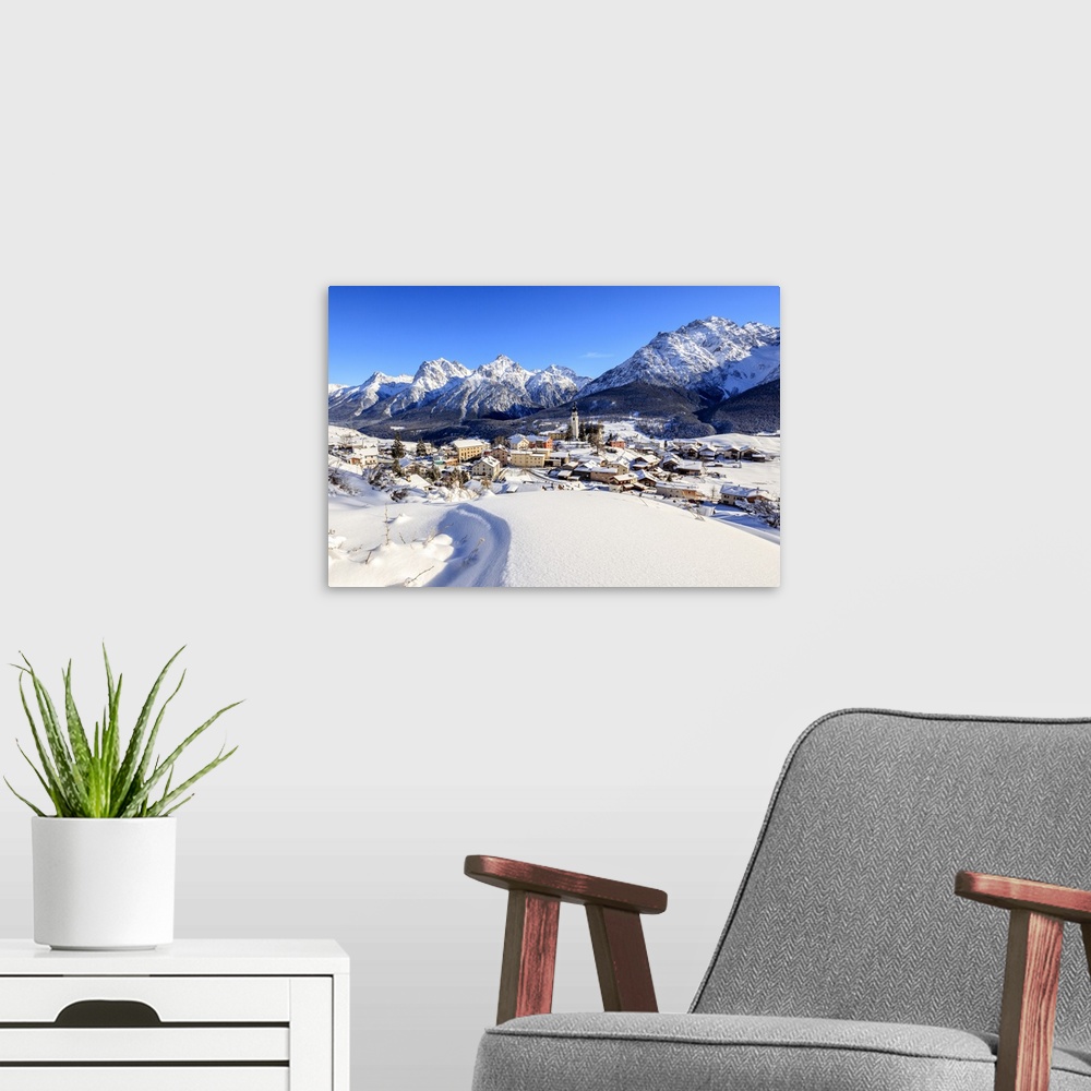 A modern room featuring Blue sky on the alpine village of Ftan surrounded by snow, Inn district, Canton of Graubunden, En...