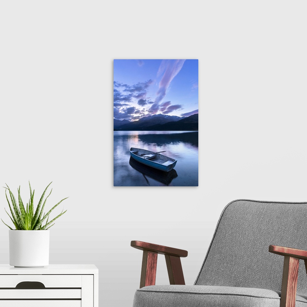 A modern room featuring Single moored boat in the Lake of Sils at sunrise, Maloja pass, Engadine valley, Graubunden, Swit...