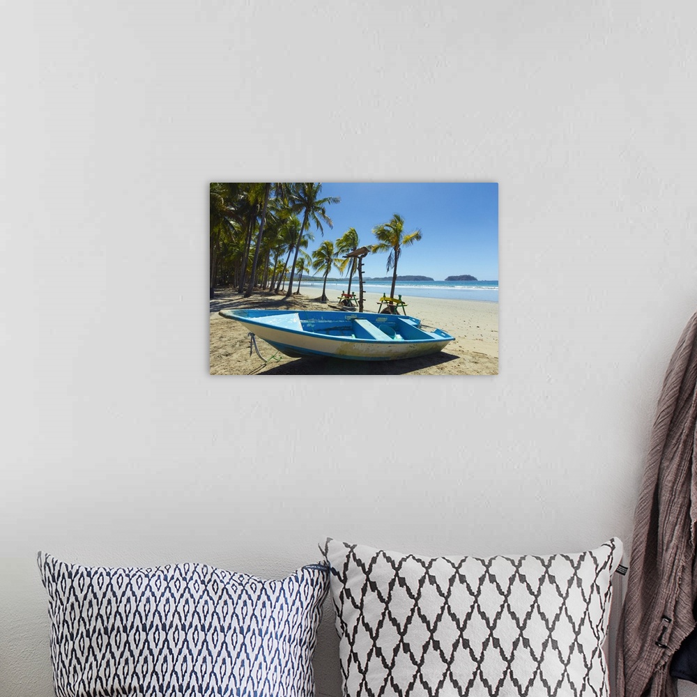 A bohemian room featuring Boat on palm-fringed beach Samara, Nicoya Peninsula, Costa Rica