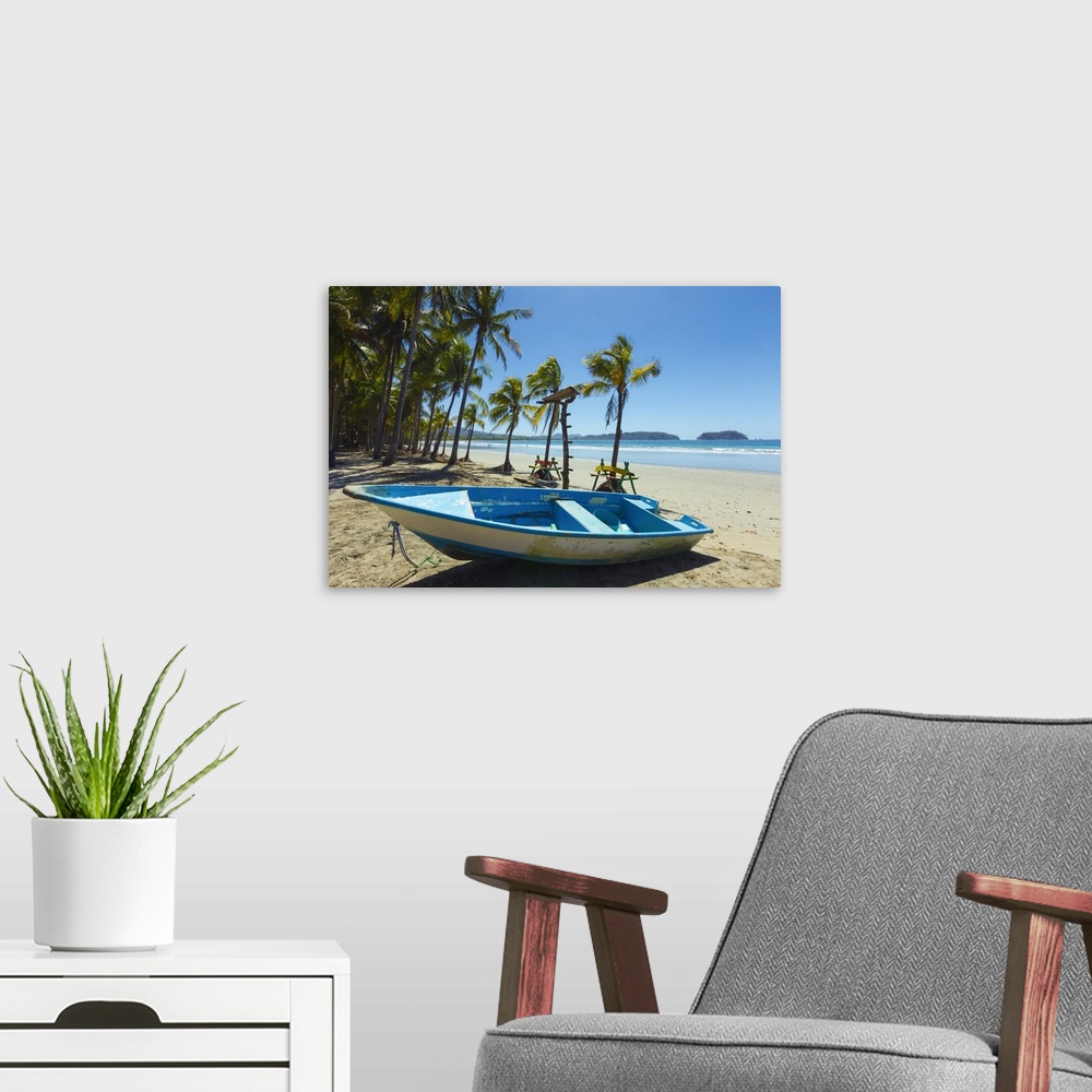 A modern room featuring Boat on palm-fringed beach Samara, Nicoya Peninsula, Costa Rica