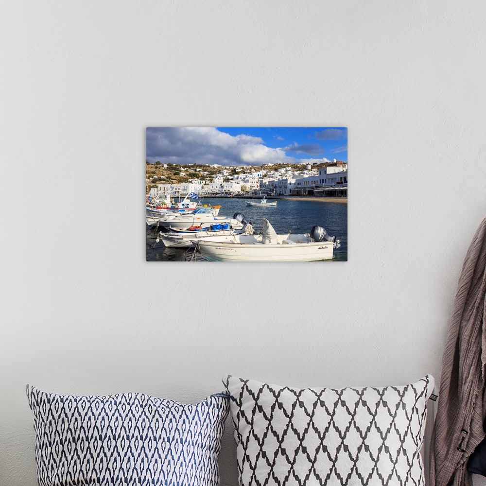 A bohemian room featuring Small boats in harbour, whitewashed Mykonos Town with windmills on hillside, Mykonos, Cyclades, G...