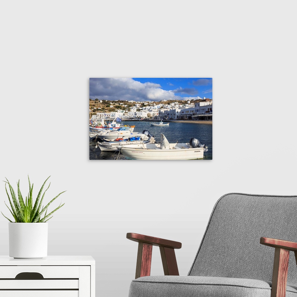 A modern room featuring Small boats in harbour, whitewashed Mykonos Town with windmills on hillside, Mykonos, Cyclades, G...