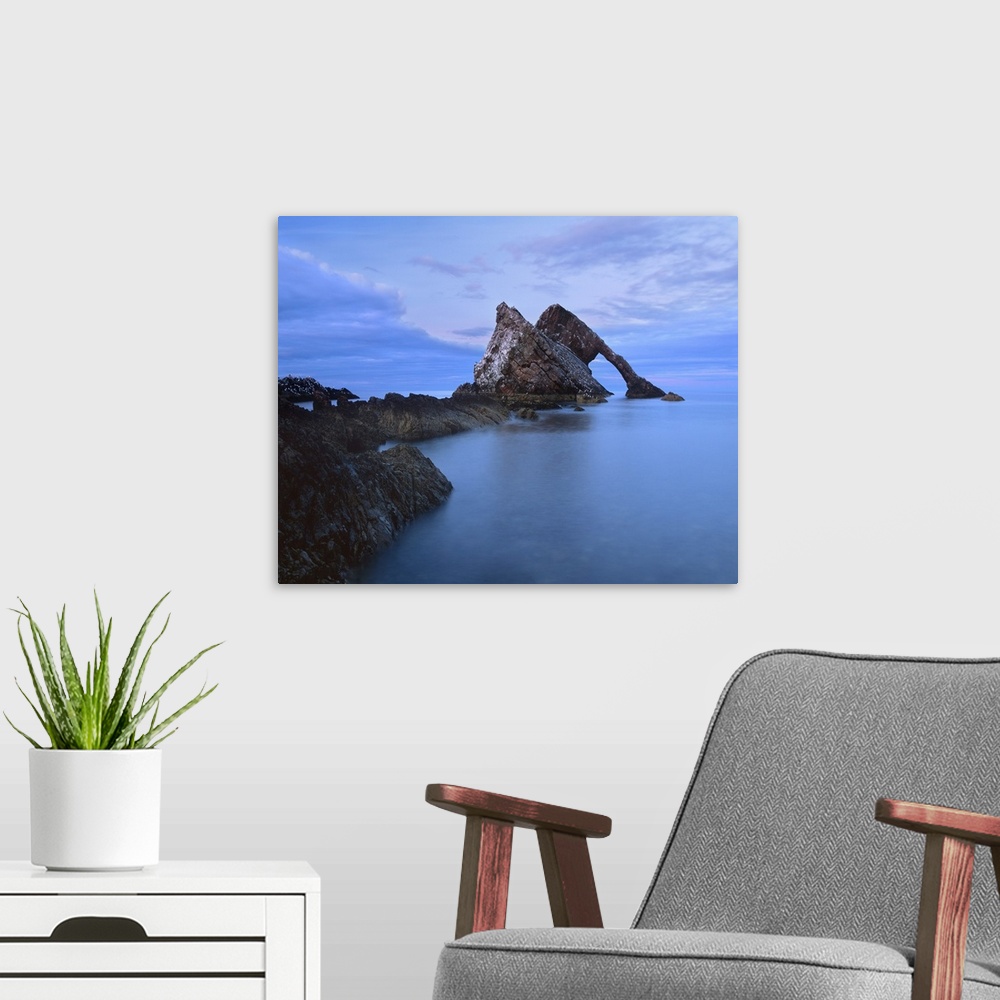 A modern room featuring Bowfiddle Rock Arch, spectacular natural arch near Portknockie, Morayshire, Scotland