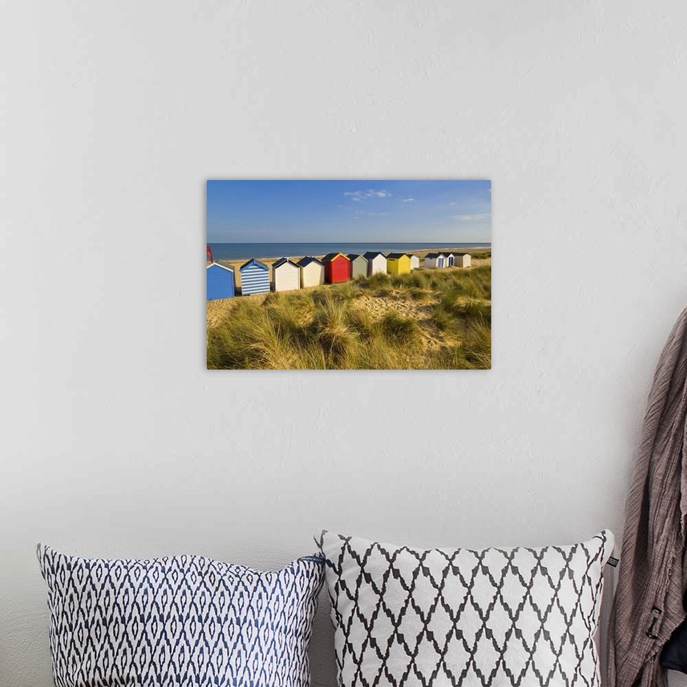 A bohemian room featuring Brightly painted beach huts, Southwold, Suffolk, England