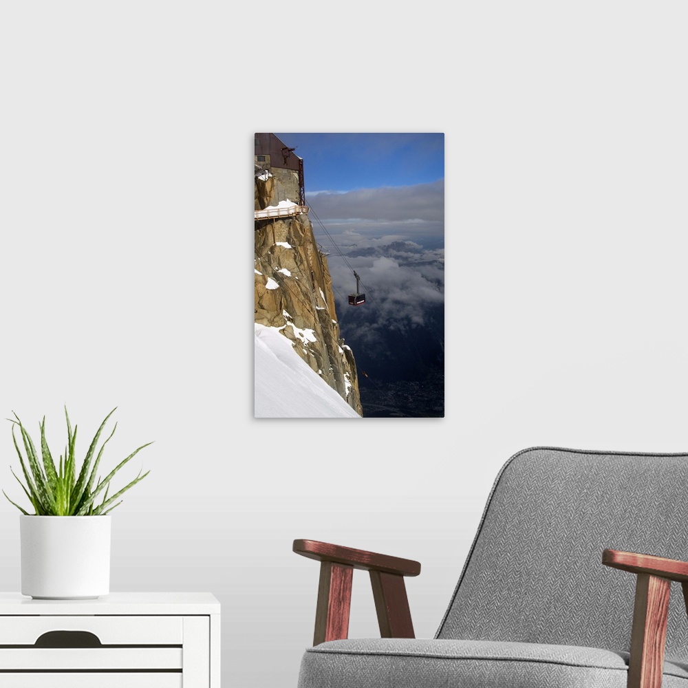 A modern room featuring Cable car approaching Aiguille du Midi summit, Chamonix-Mont-Blanc, French Alps, France