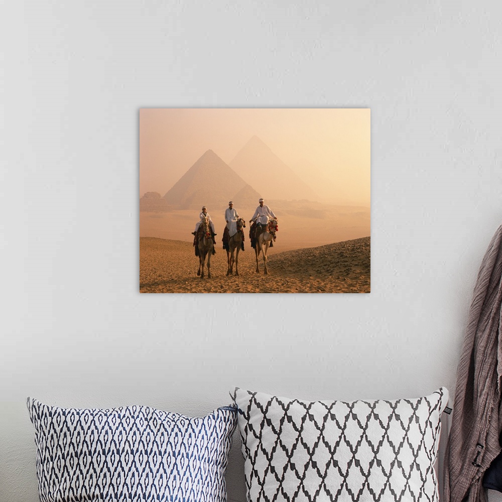 A bohemian room featuring Camel riders at Giza Pyramids, Giza, Cairo, Egypt, Africa