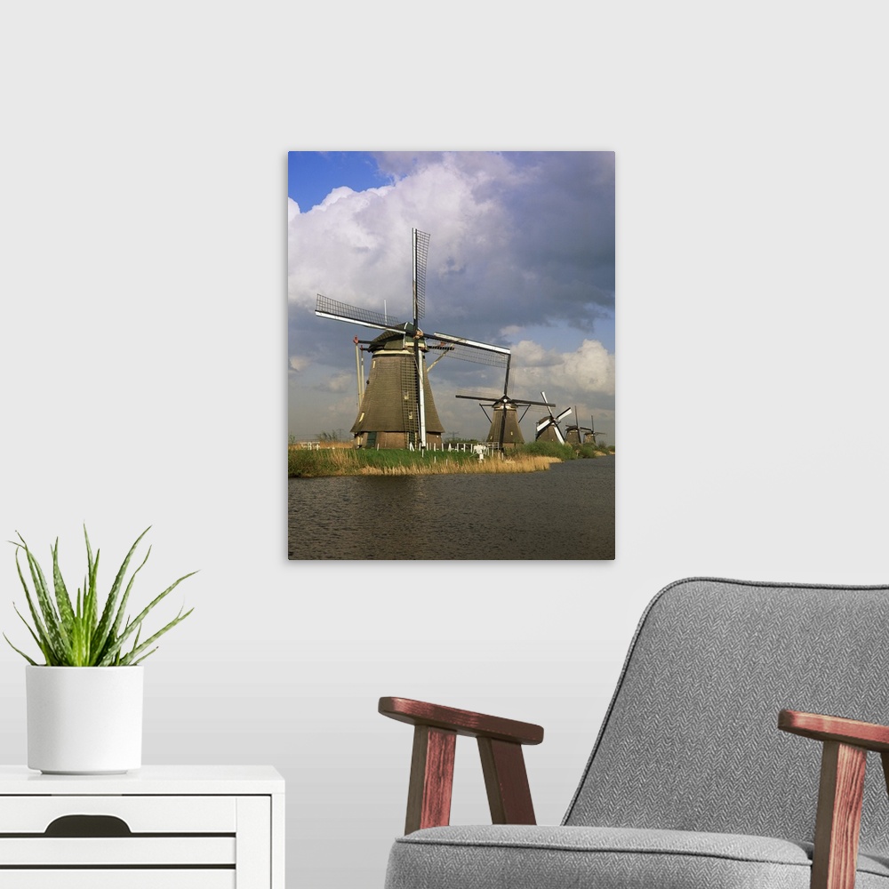 A modern room featuring Canal and windmills at Kinderdijk, Holland