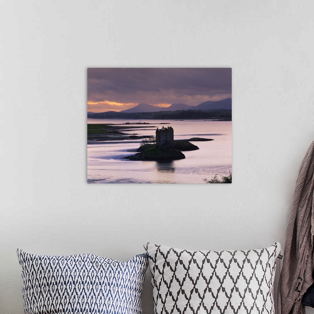A bohemian room featuring Castle Stalker on Loch Linnhe, silhouetted at dusk, Argyll, Scotland, UK