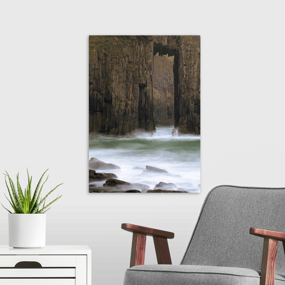 A modern room featuring Church Doors rock formation in Skrinkle Haven cove, Wales, UK