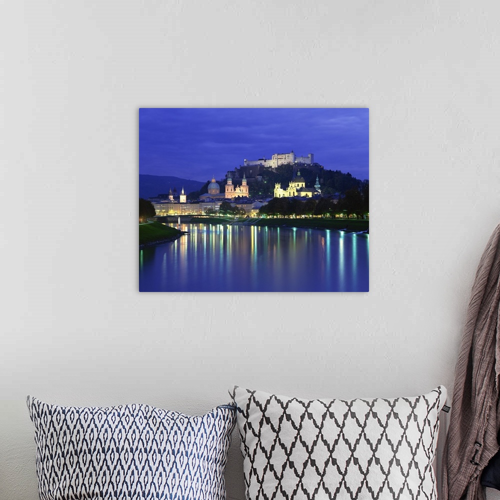 A bohemian room featuring City and castle at night from the river, Salzburg, Austria