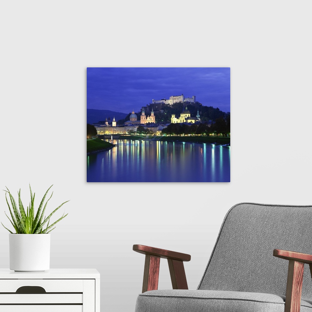 A modern room featuring City and castle at night from the river, Salzburg, Austria