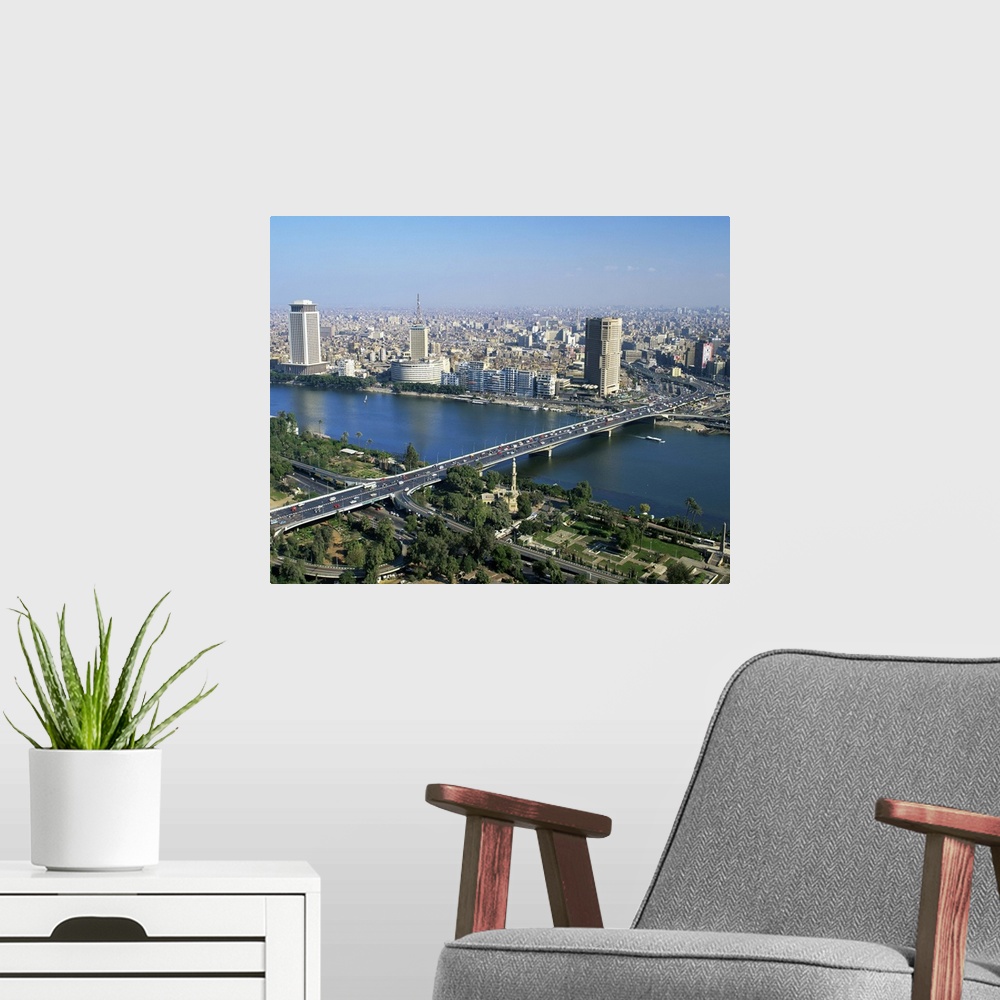 A modern room featuring City skyline with the 6th October Bridge over the River Nile, Cairo, Egypt, Africa
