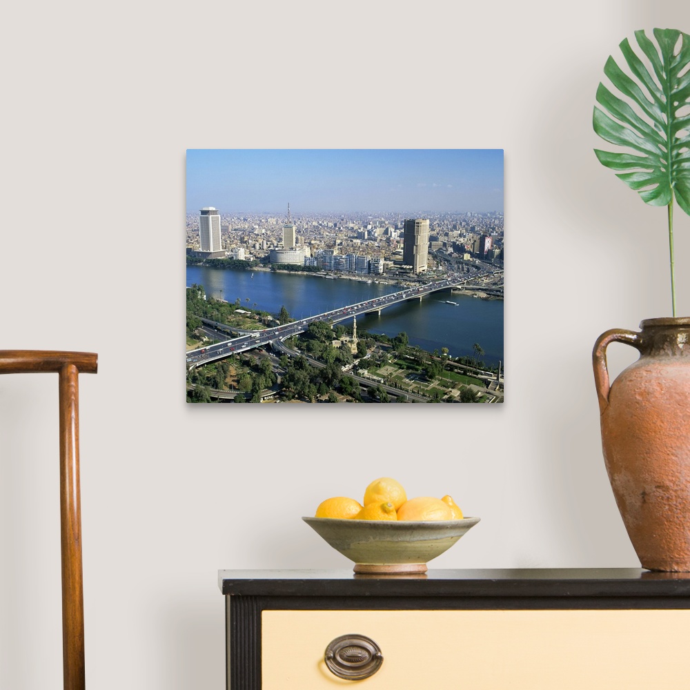 A traditional room featuring City skyline with the 6th October Bridge over the River Nile, Cairo, Egypt, Africa